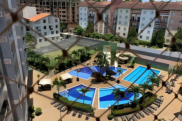 Apto Rio Quente - Vista piscina e ar cond na suíte